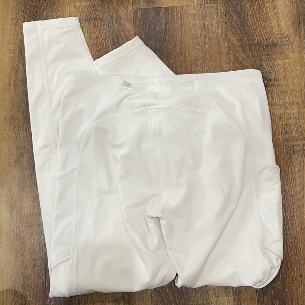 Lululemon size 6 white leggings. Worn twice. Tiny spot on top.